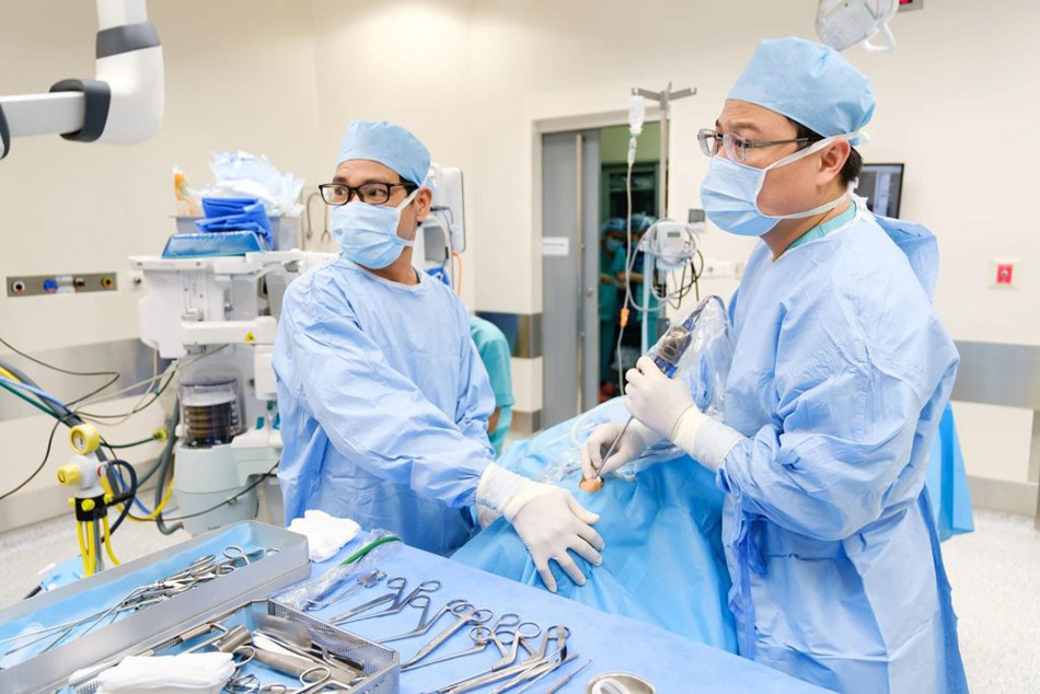 Vo Cong Minh, MD, PhD, Head of the Otolaryngology Department at FV Hospital, performs sinus surgery on the paediatric patient