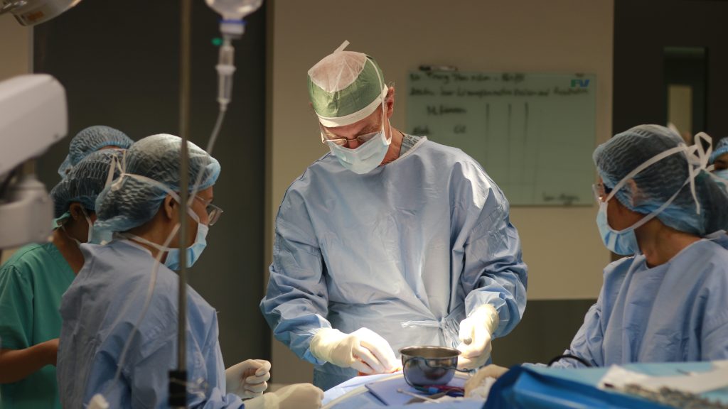 Professor McKay McKinnon and the medical team at FV Hospital performing tongue-reduction surgery on little N.D.T